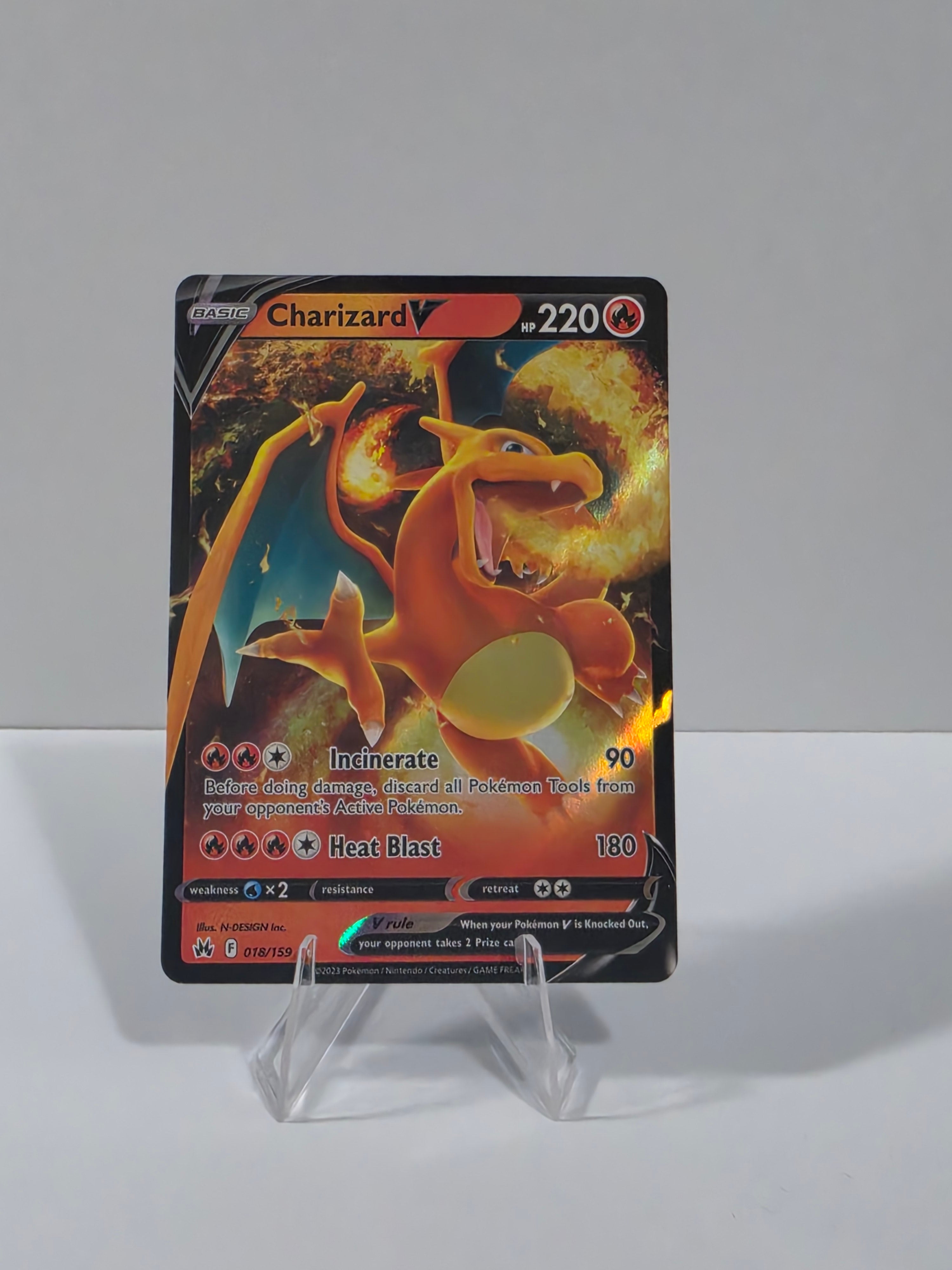 Charizard trading card in a clear protective holder on a white background