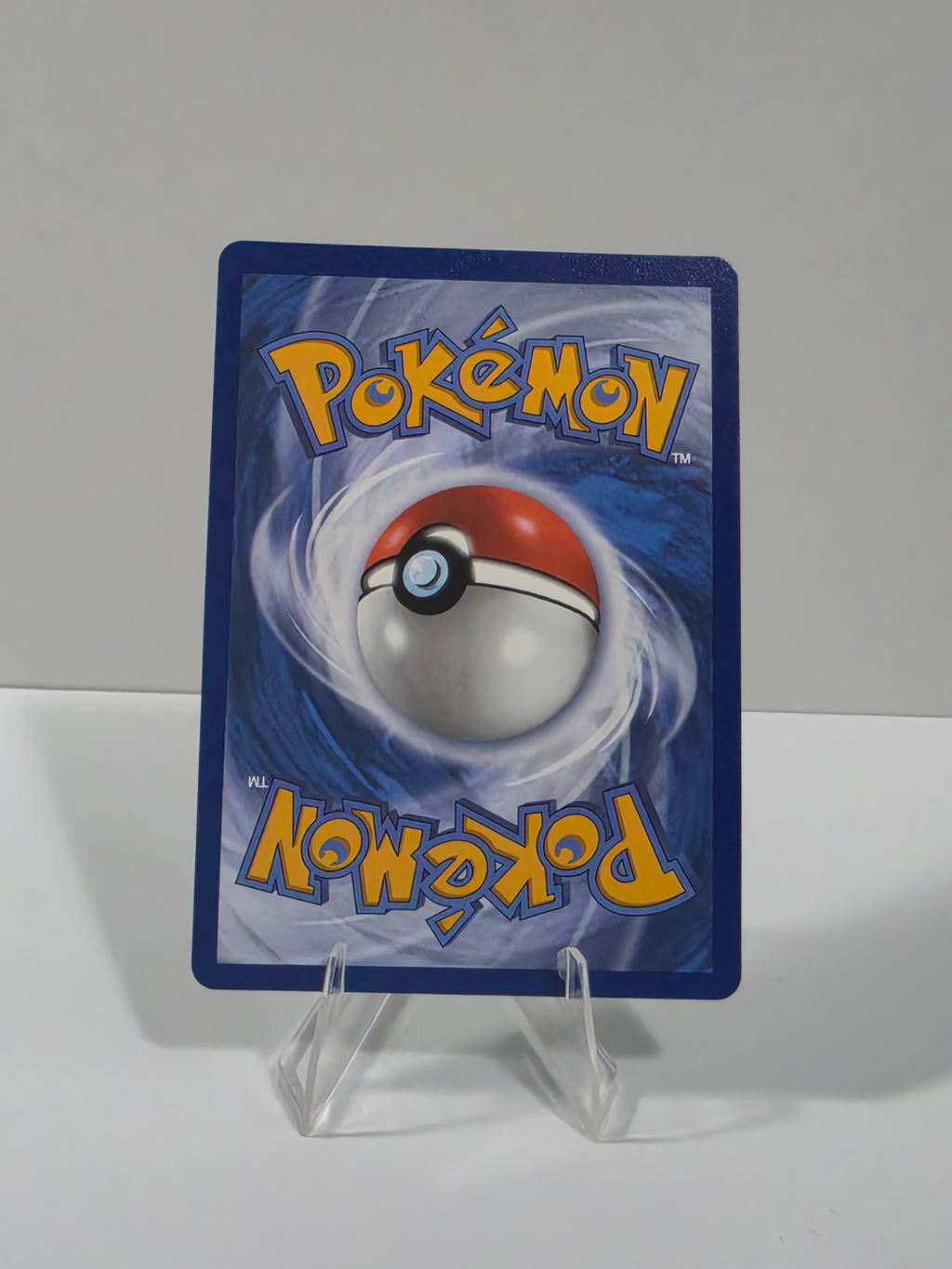 Pokémon trading card with blue border and Pokéball logo on a white background
