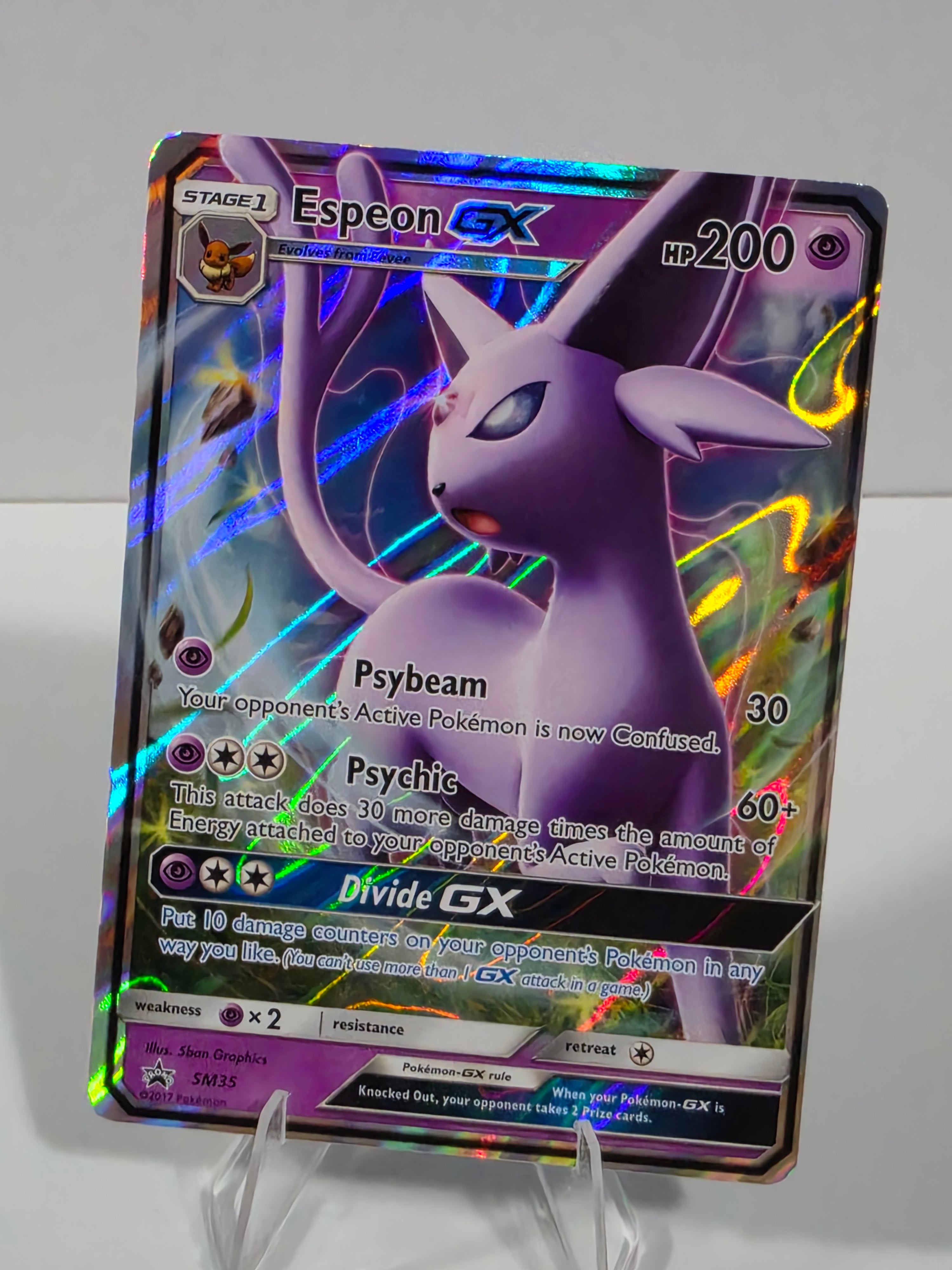 Pokémon trading card featuring Espieon EX on a reflective surface