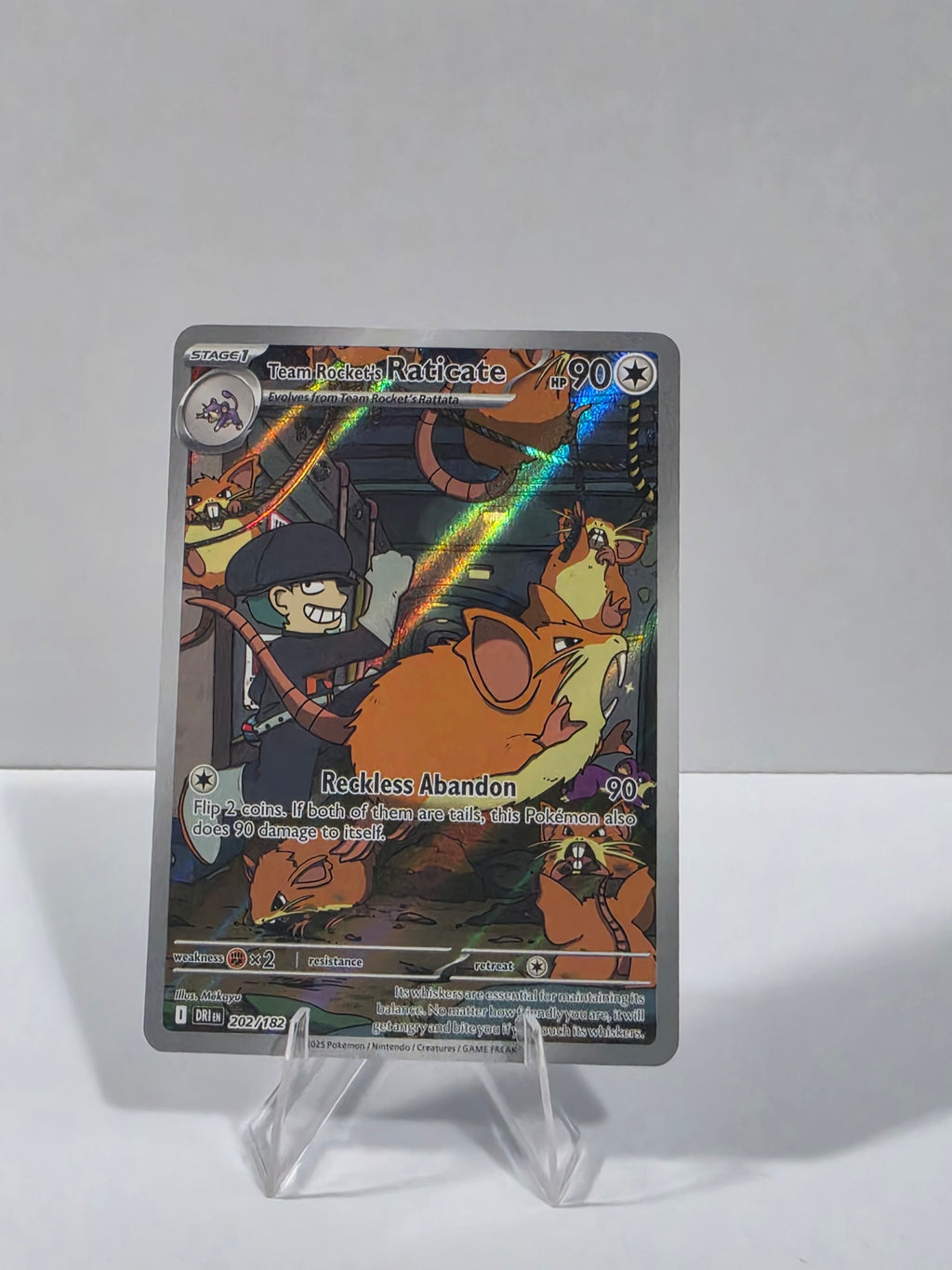 Trading card featuring a character with a rainbow effect on a white background