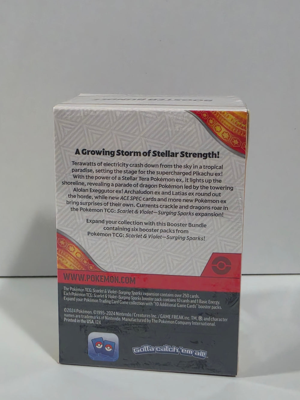 Back view of a Pokémon trading card game booster pack with text and branding.